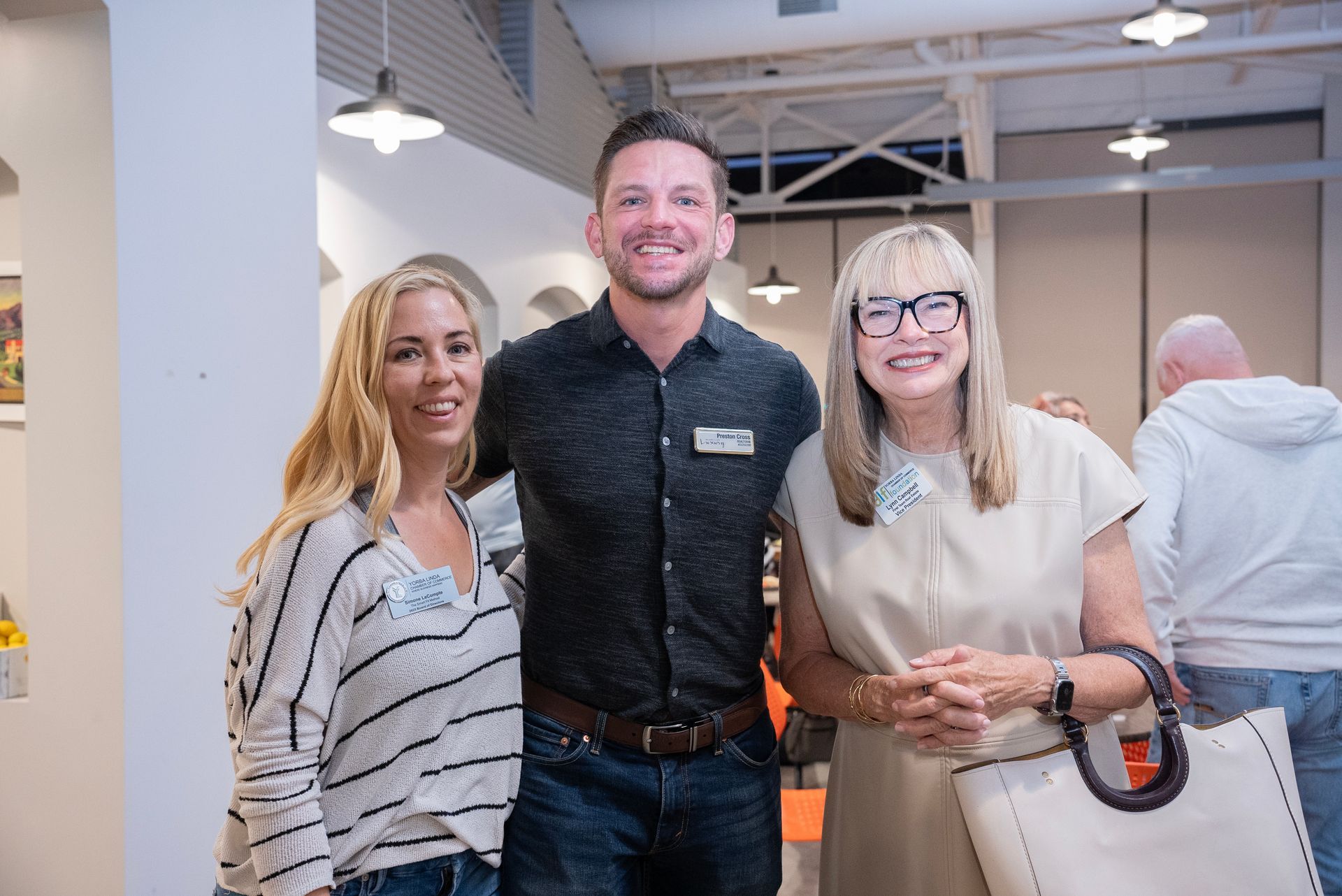 People cutting a ribbon in front of 