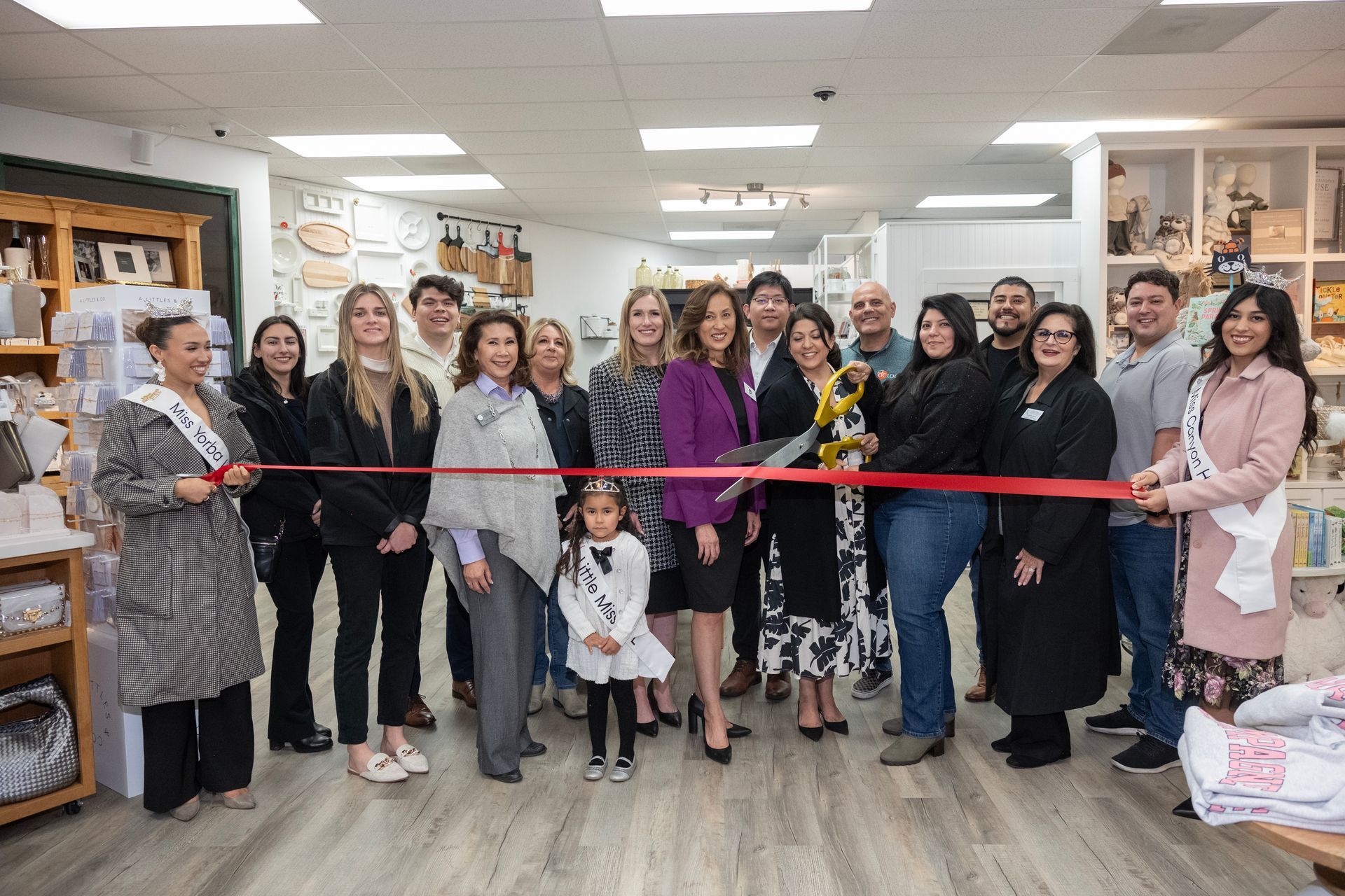 People toasting with glasses outside a building with 