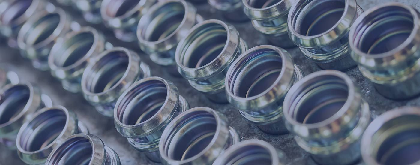 A close up of a bunch of metal rings on a table.