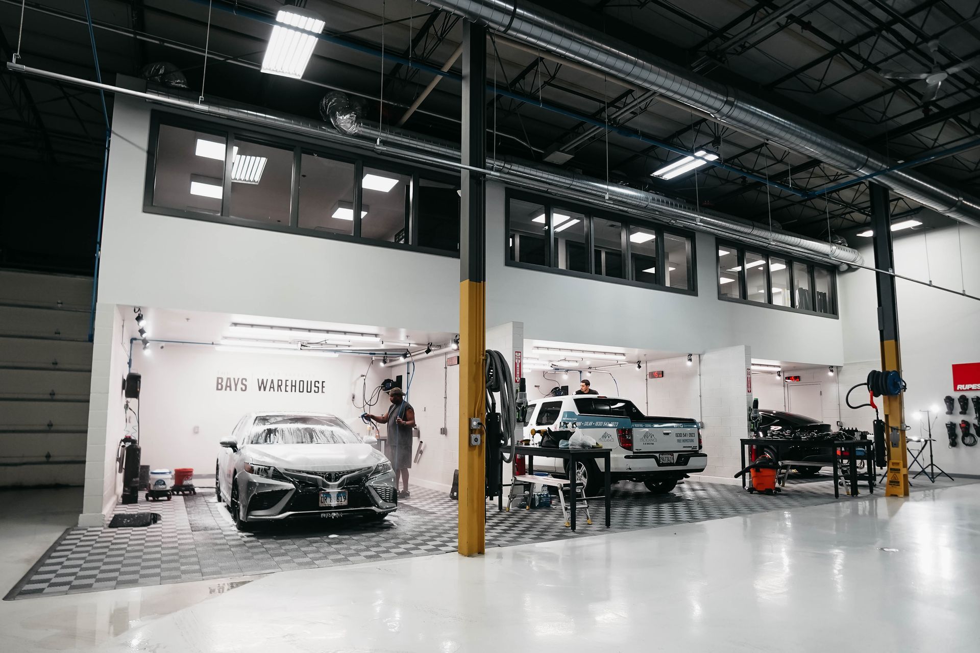 A car is being worked on in a garage.