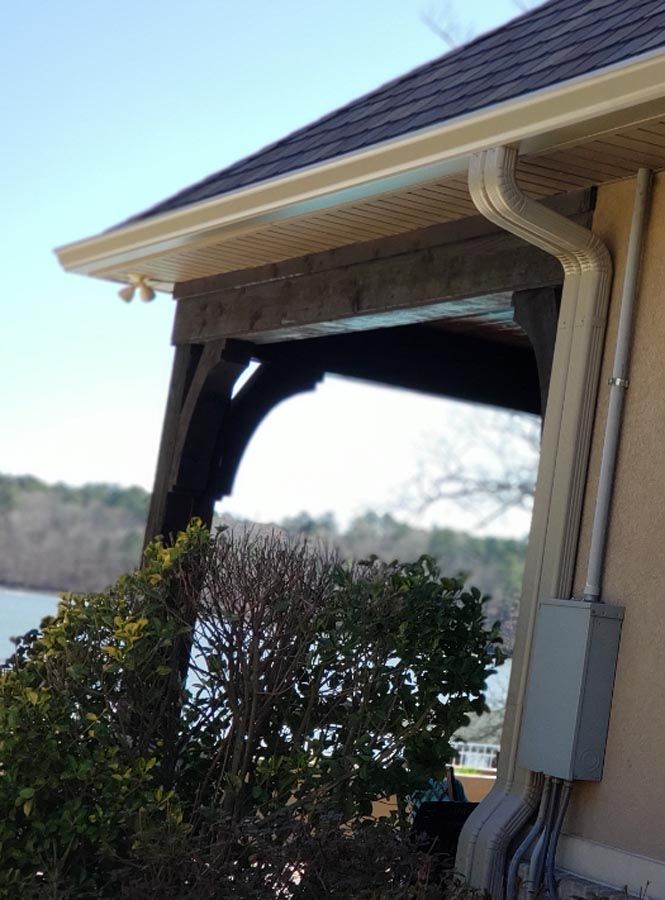 A house with a gutter on the side of it