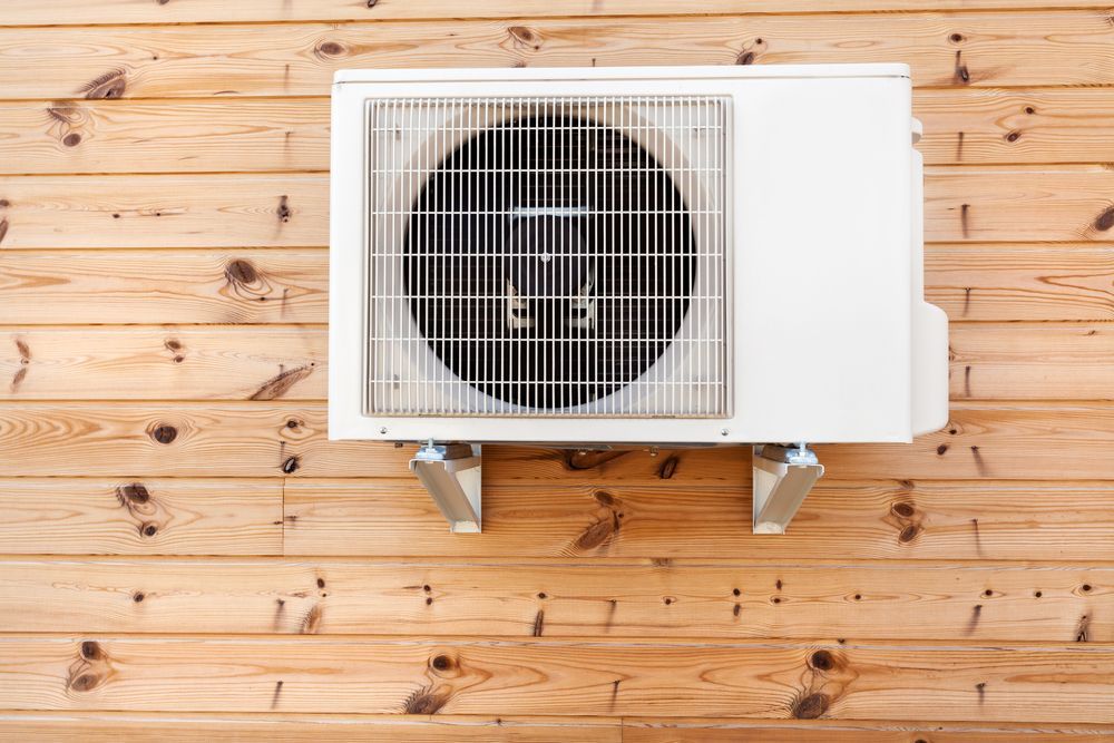 Air Conditioning Unit Mounted on a Wooden Wall — Escarpment Air in Mount Saint Thomas, NSW