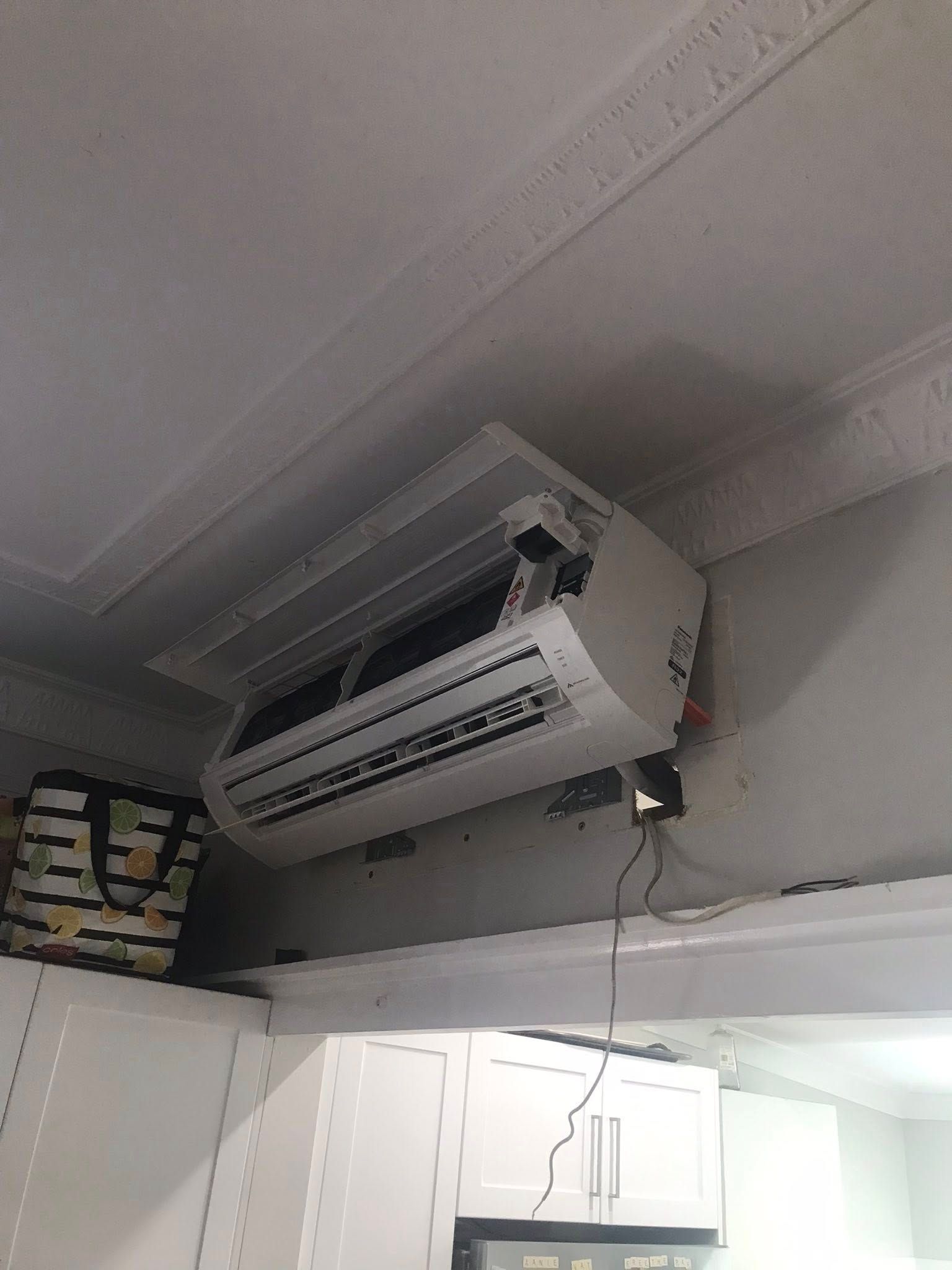 White Air Conditioner Mounted on a Wall — Escarpment Air in Mount Saint Thomas, NSW