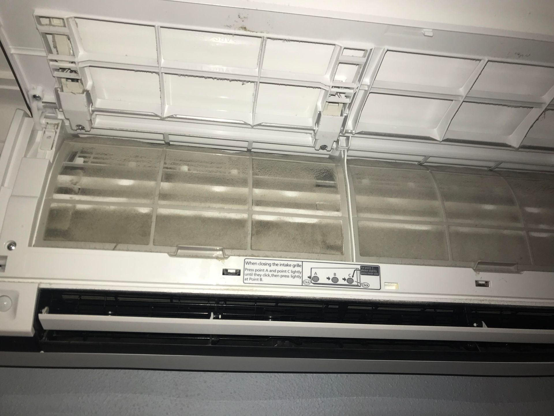 Dirty air conditioning unit filter, covered in dust and debris, interior shot. — Escarpment Air in Shellharbour, NSW