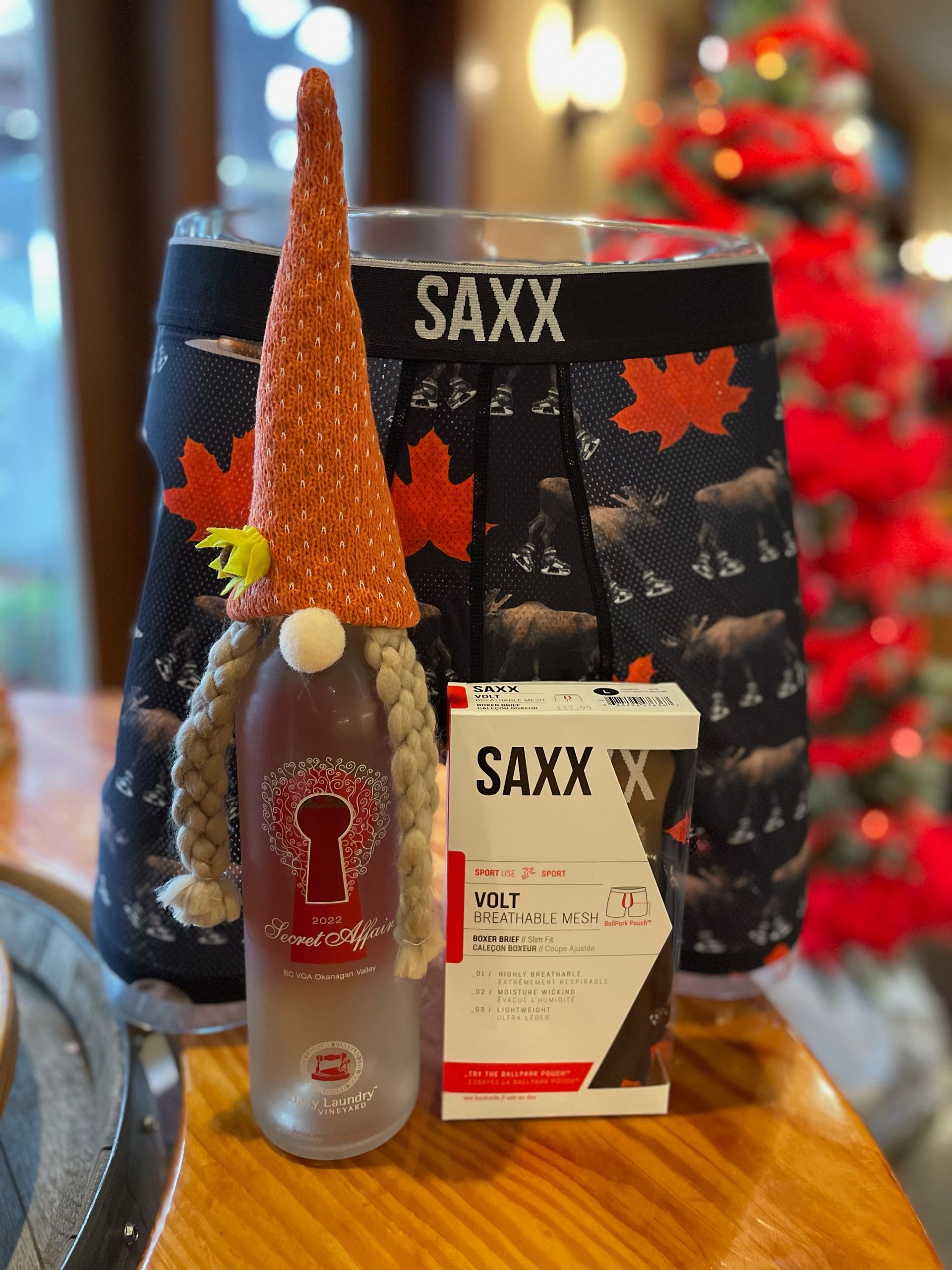 A bottle of saxx next to a box of saxx