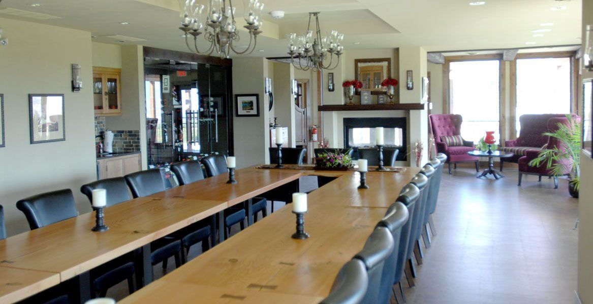 A long table with candles on it in a room