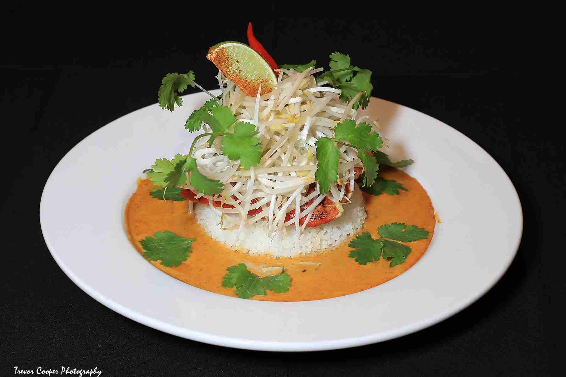 A close up of a plate of food with a black background