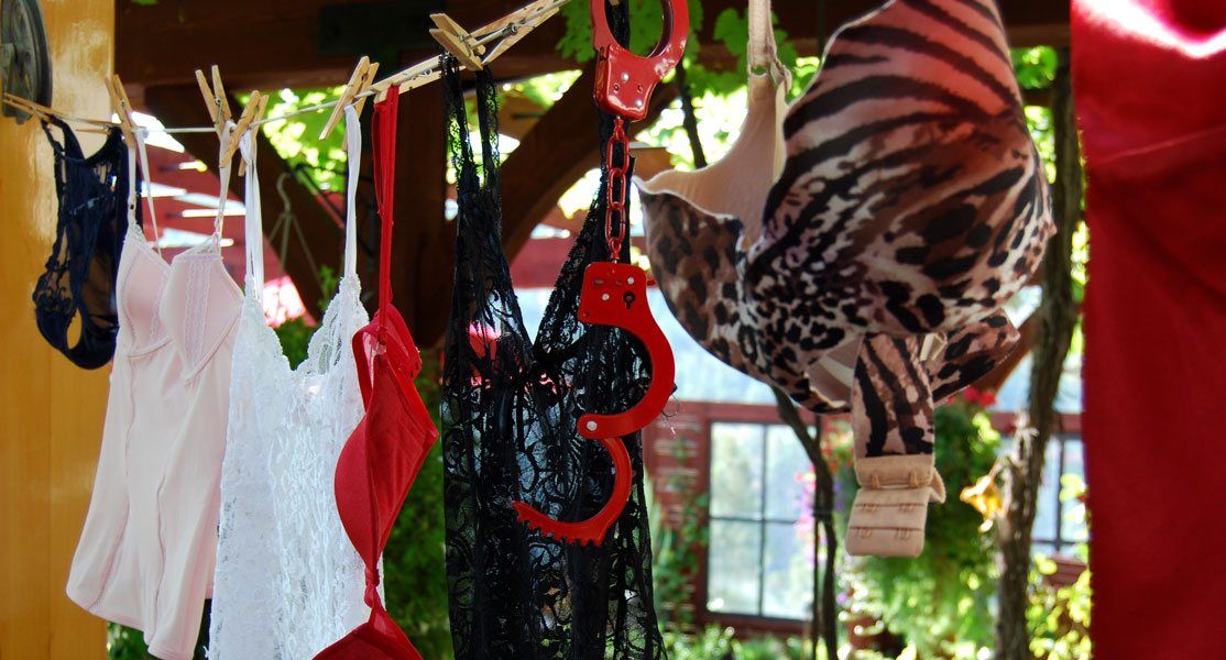 A bunch of clothes are hanging on a clothes line