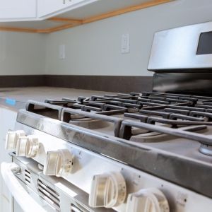 plumber installing gas line on appliance oven in Castle Rock.