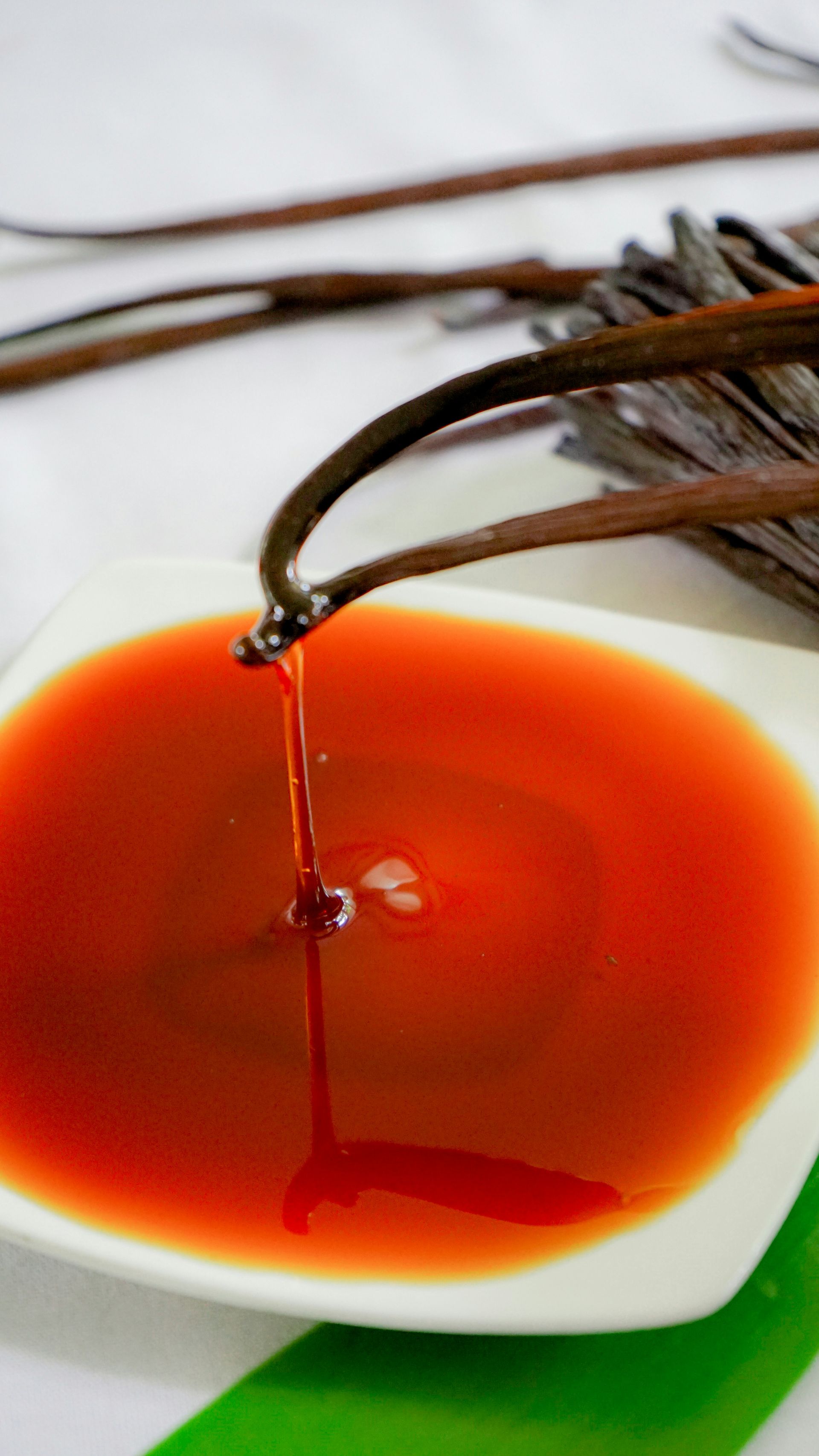 A close up of a bowl of sauce on a table.