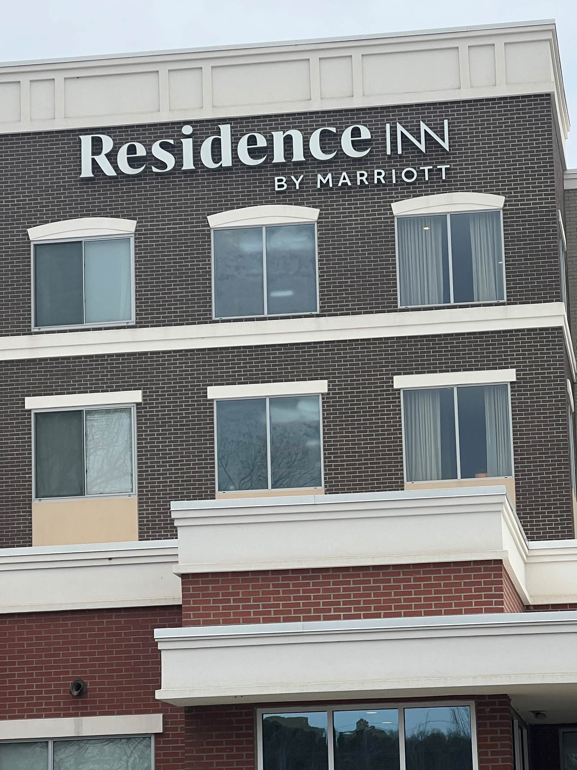 A brick building with the word residence on it