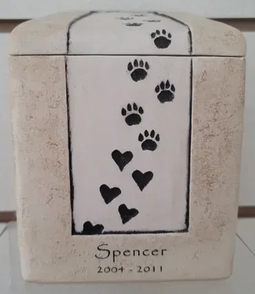 A ceramic urn for a dog named spencer