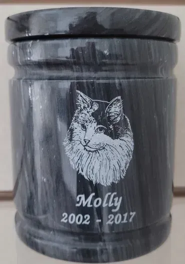 A black urn with a picture of a cat on it