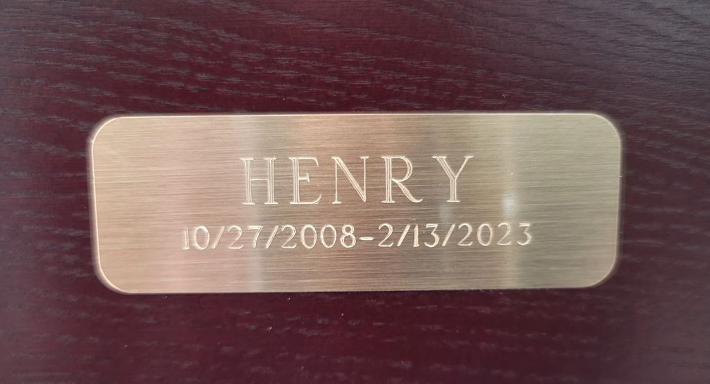 A plaque with the name henry on it