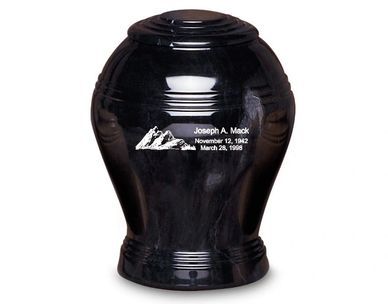 A black urn with the name joseph a. mack on it