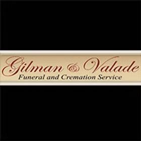 Gilman & Valade Funeral and Cremation Service logo. Light brown text on dark background.