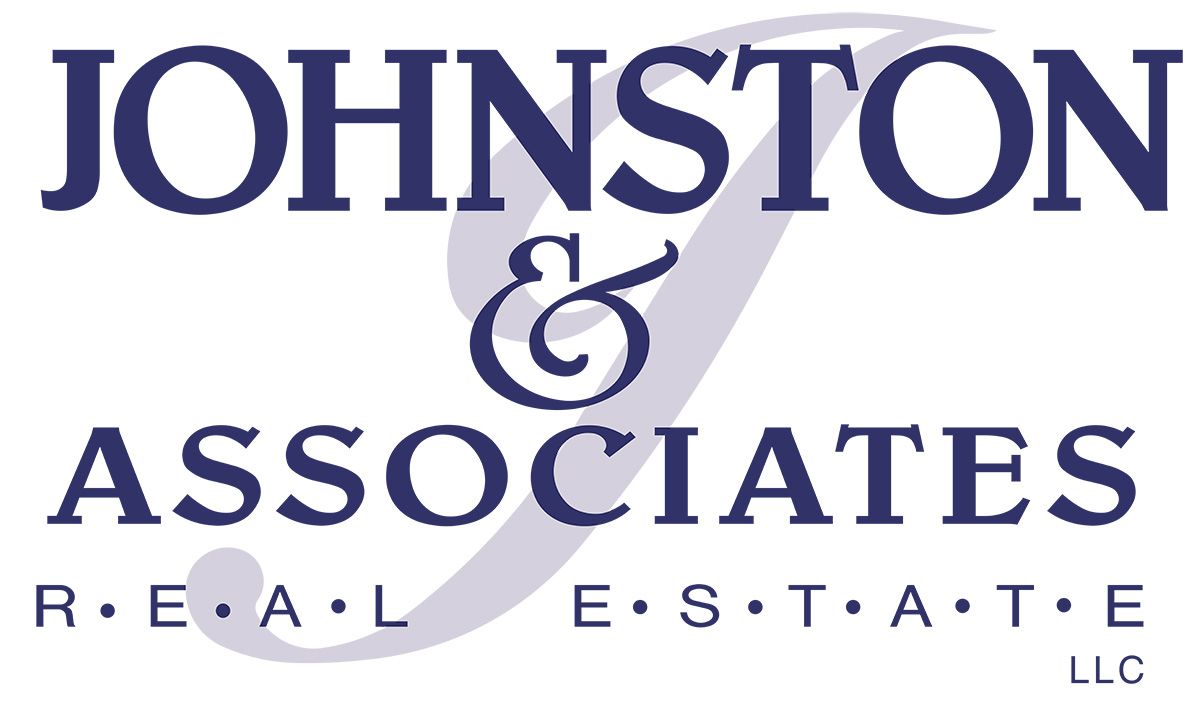Johnston & Associates real estate logo in navy blue;