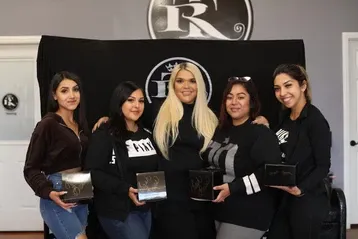 Beautiful women holding certificate | Sylmar, CA | Rave Beauty Bar
