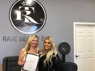Two women holding her certificate | Sylmar, CA | Rave Beauty Bar