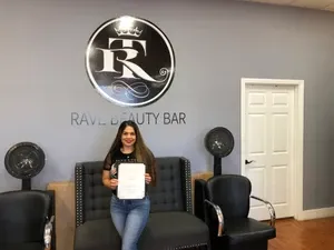 Beautiful woman holding certificate | Sylmar, CA | Rave Beauty Bar