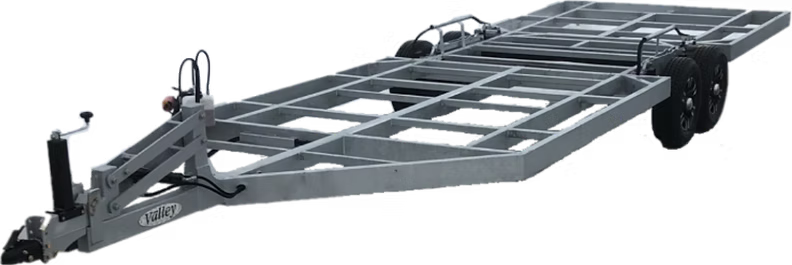 A gray open car trailer with no car on it.