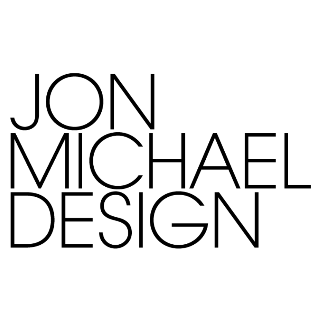 the logo for jon michael design is black and white .