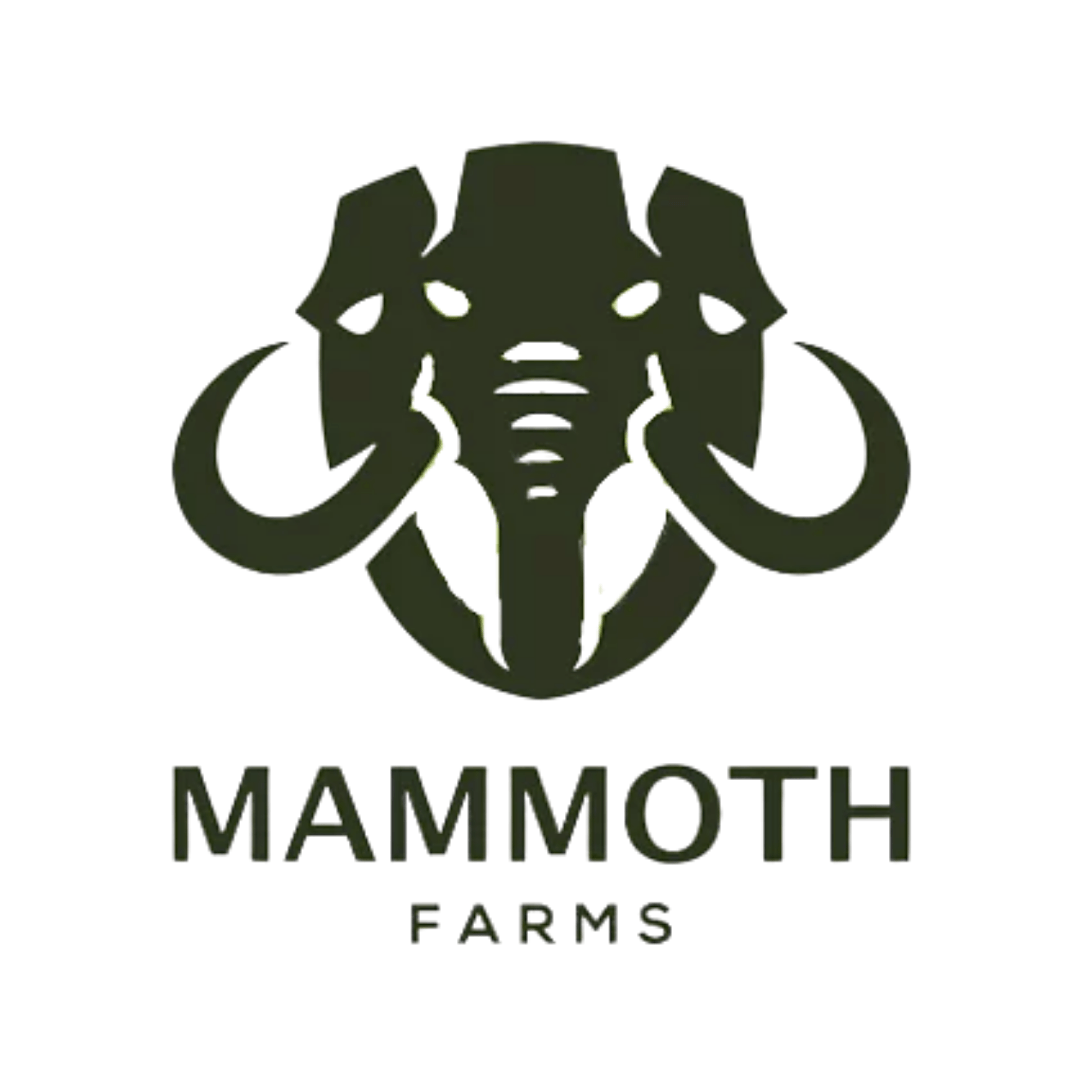a logo for mammoth farms with an elephant head and tusks