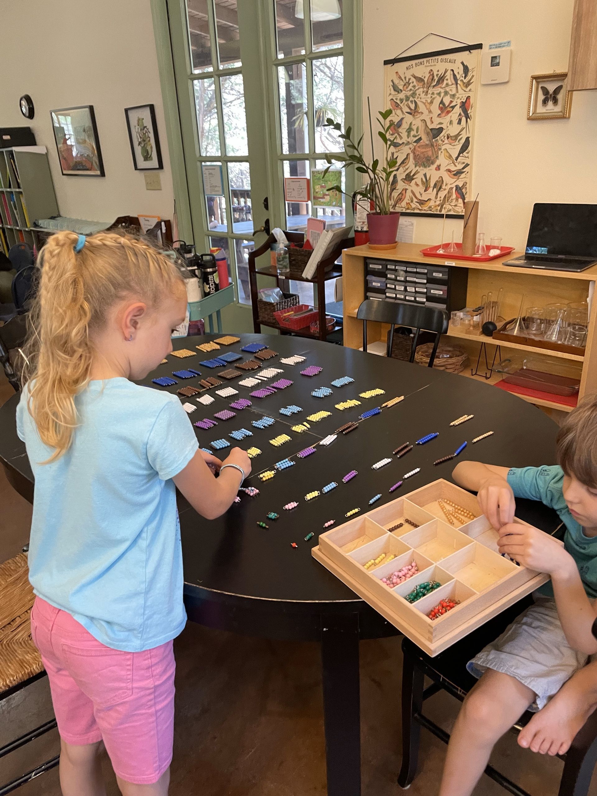 montessori child working math materials