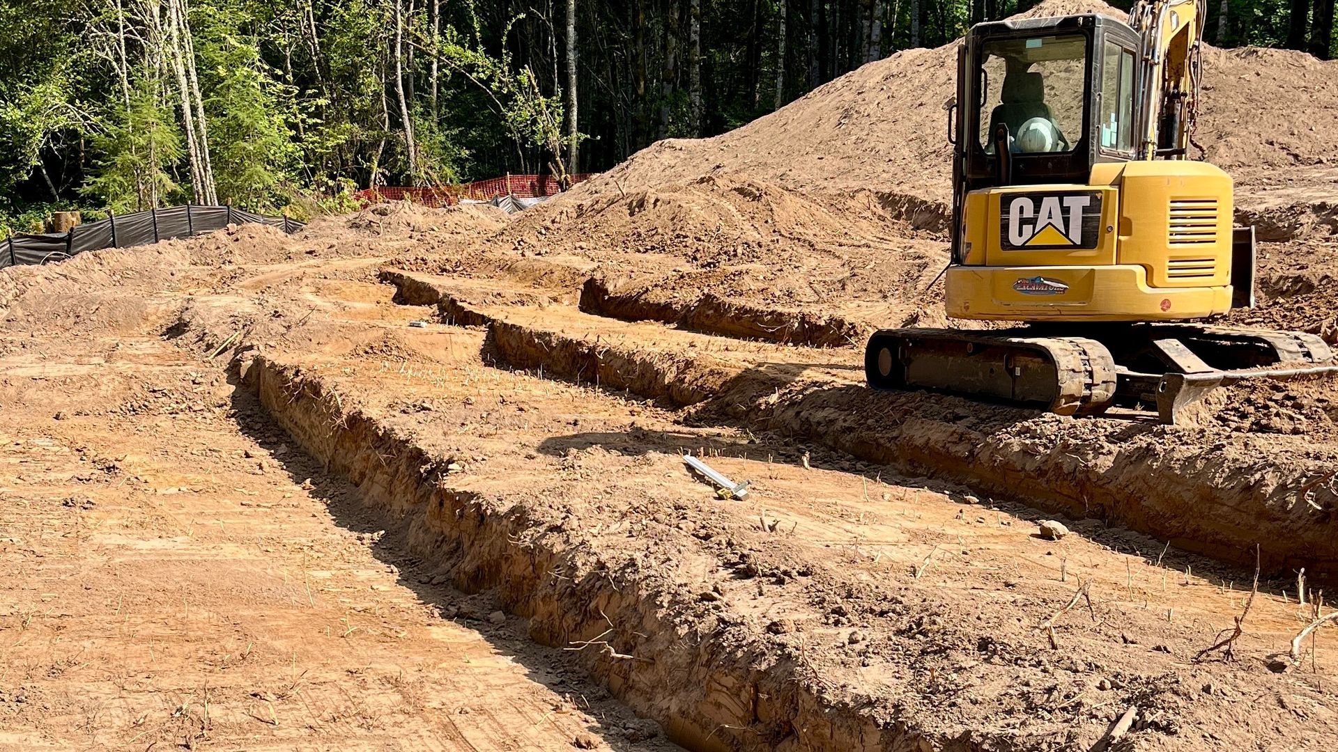 A man is fixing a toilet in a bathroom