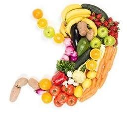 Fruits and vegetables arranged in the shape of a stomach; promoting healthy eating.