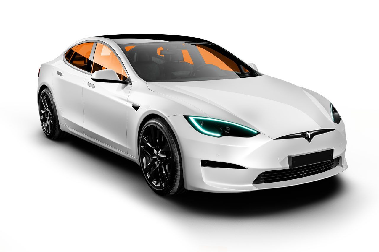 White Tesla sedan with black wheels, parked on a white surface.
