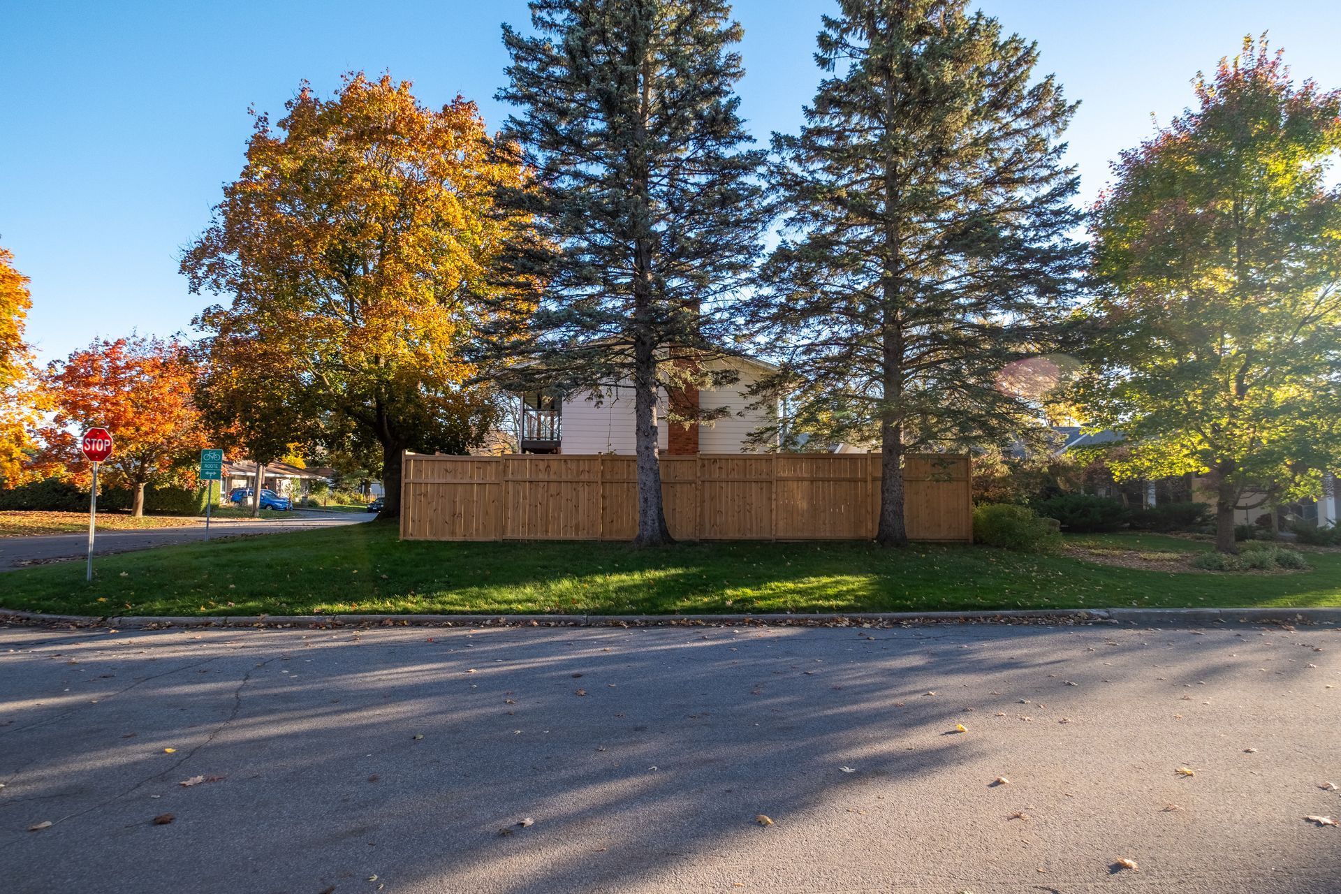 A house with a wooden fence in front of it