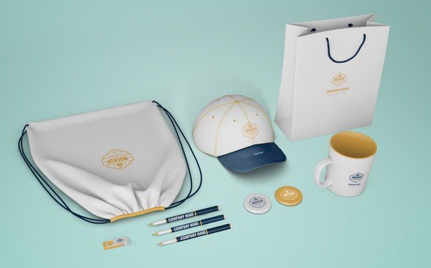A mockup of a hat , a bag , a cup , pens , buttons and a drawstring bag.