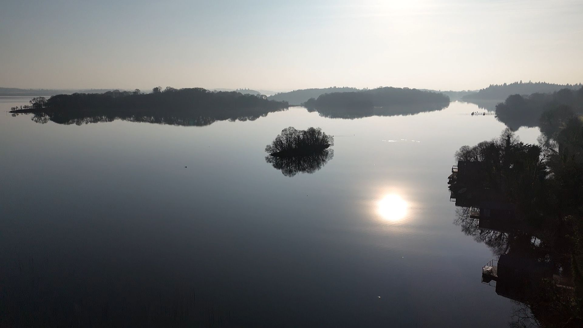 A large body of water with a small island in the middle