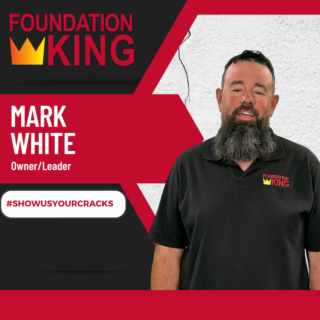 A man with a beard is wearing a foundation king shirt