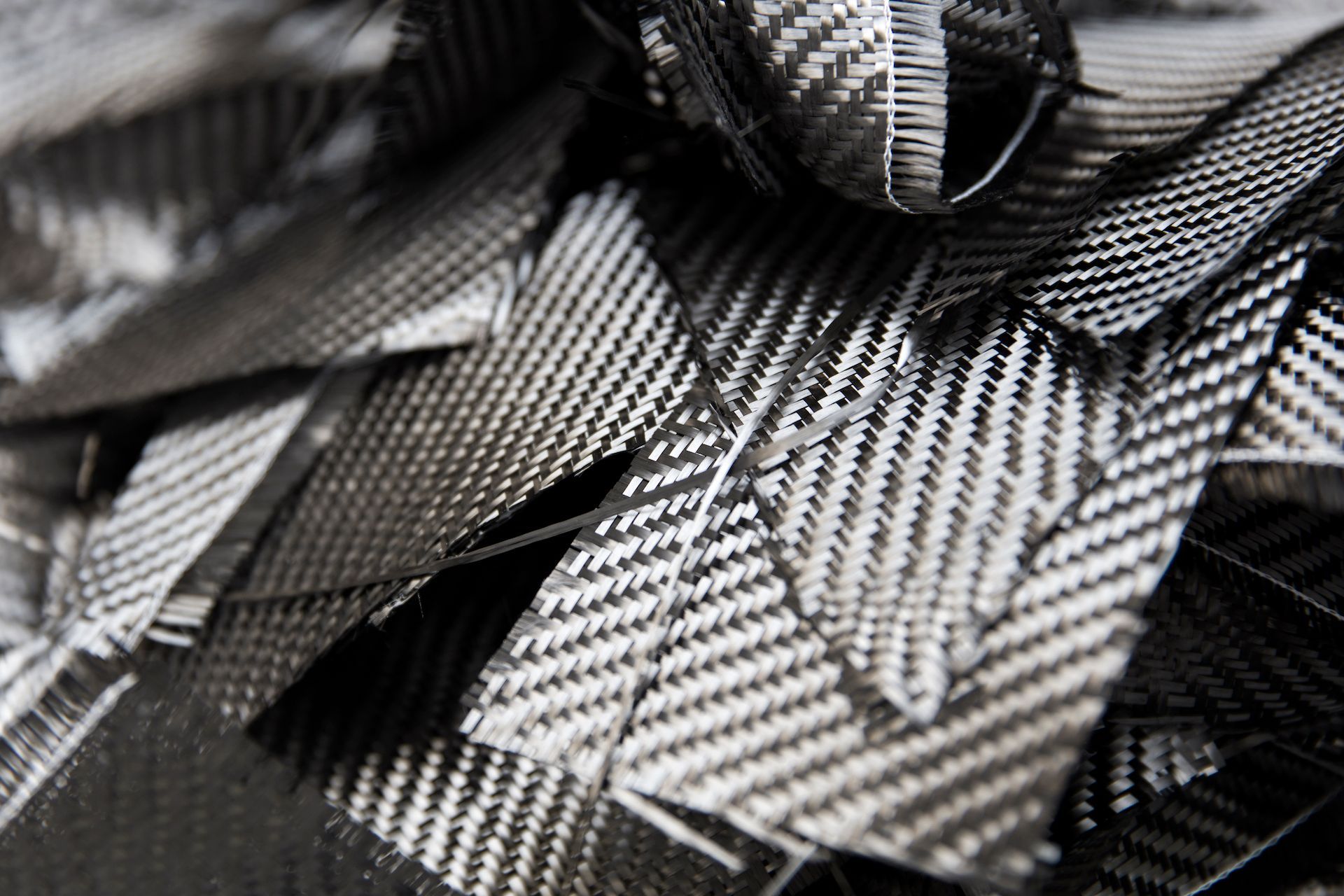 A close up of a pile of black and white pieces of fabric