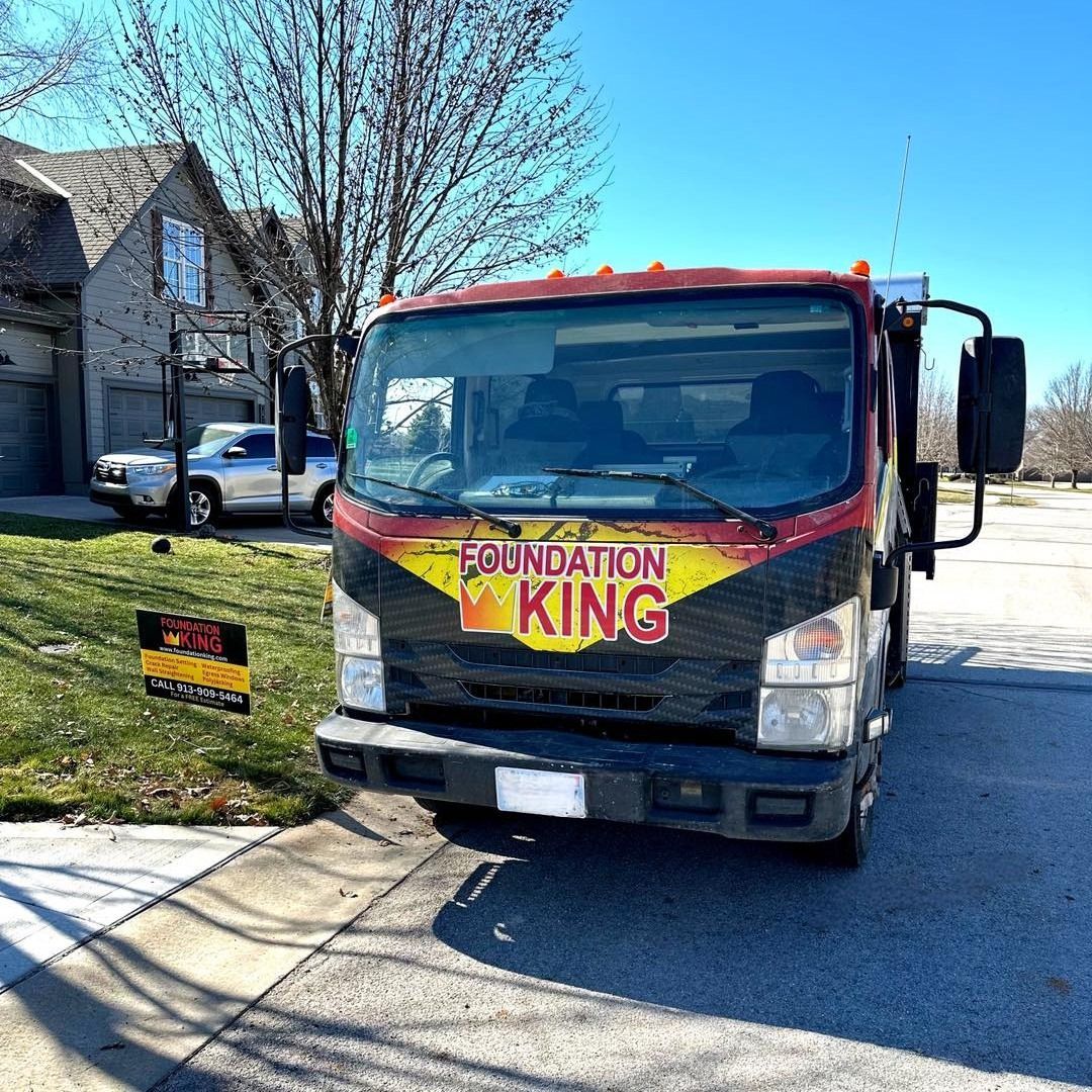 Foundation King truck out front of a house