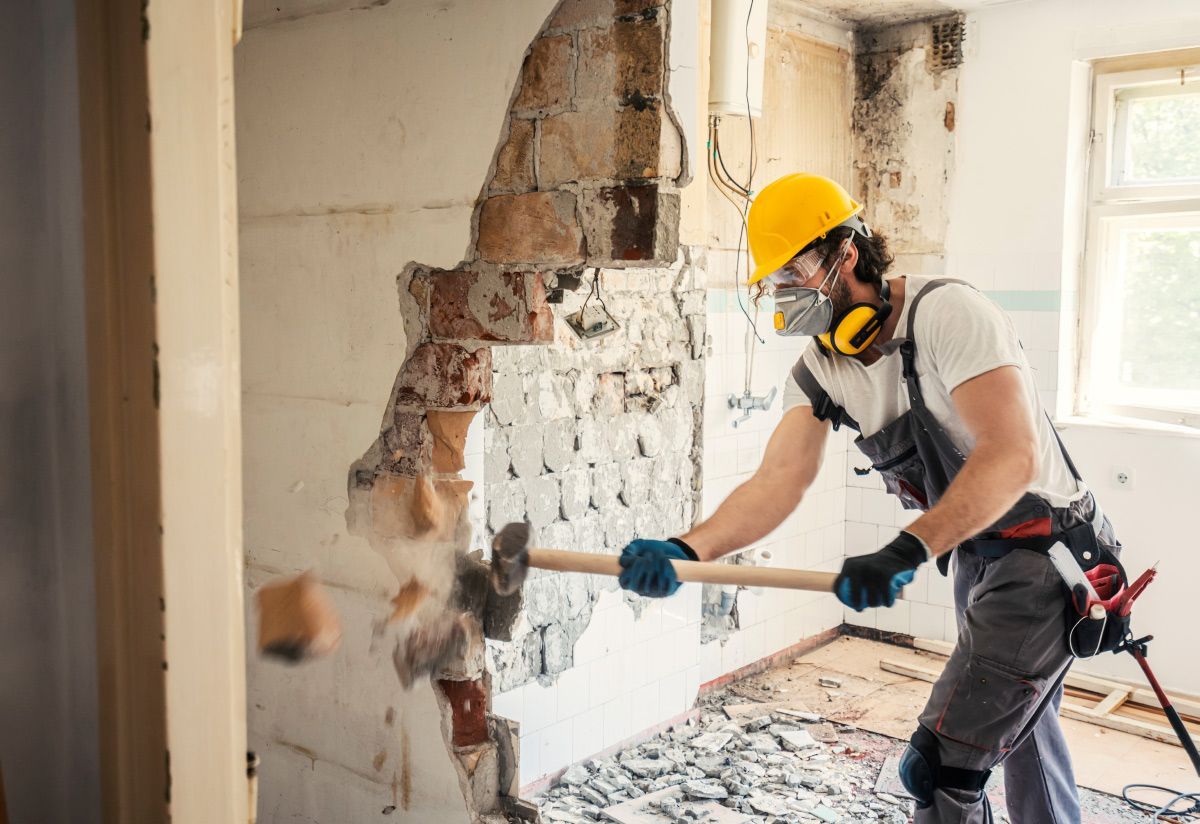 Worker Using Hammer — Warwick, RI — Restoration ASAP