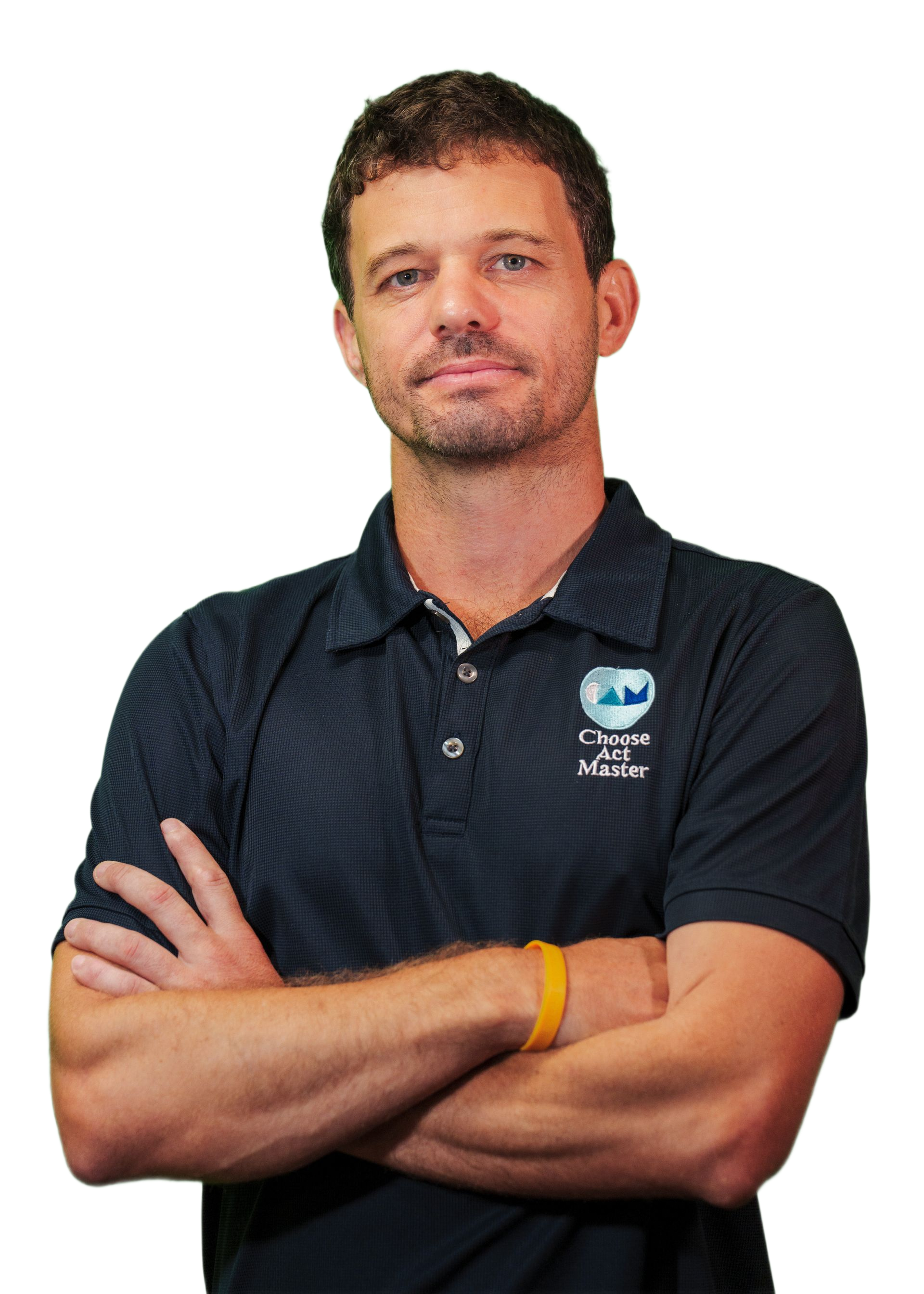 Man with crossed arms wearing a navy polo shirt with logo