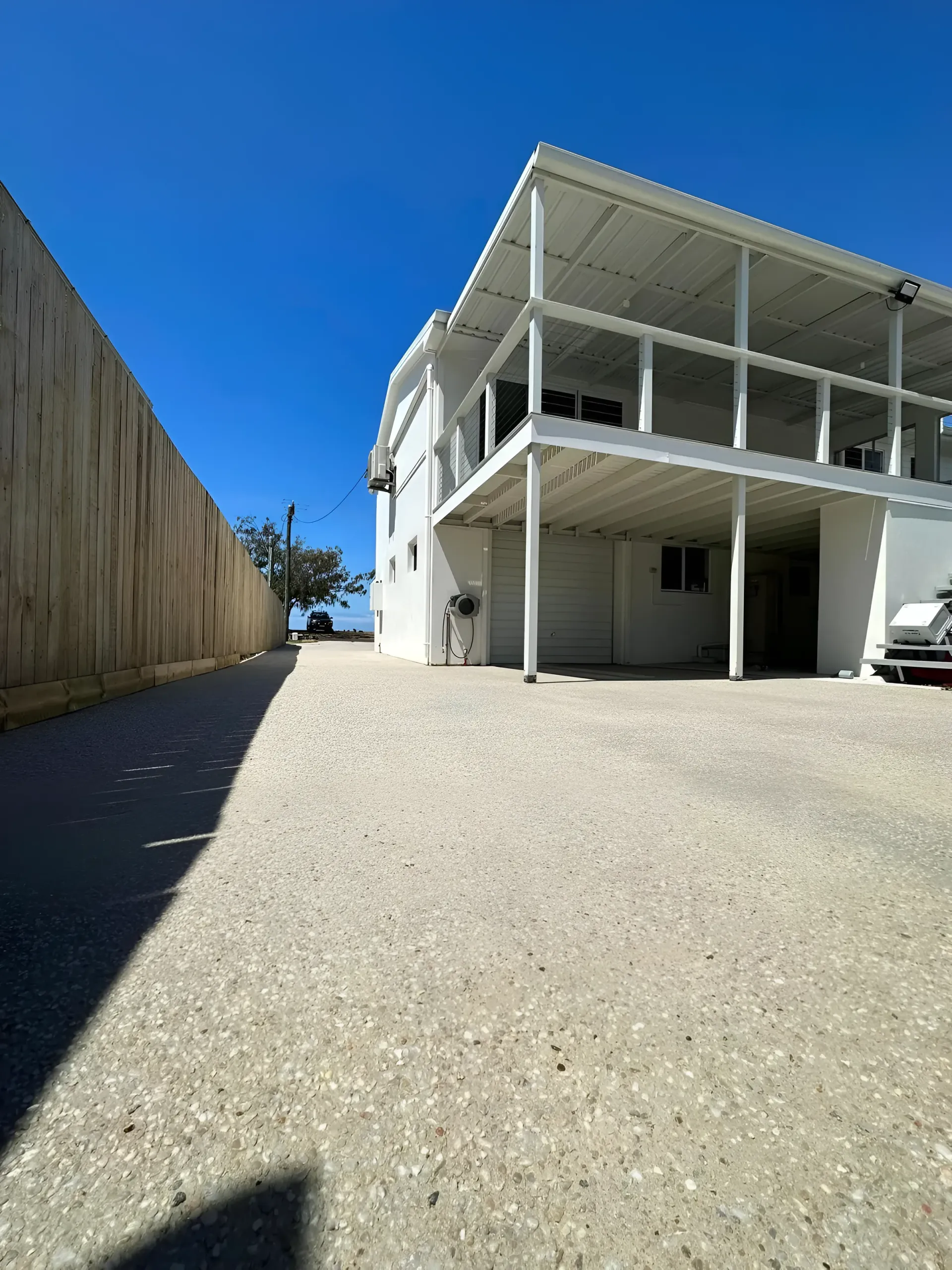 White Two-story Building With a Covered Balcony — Showcase Concrete & Polishing in Moore Park Beach, QLD