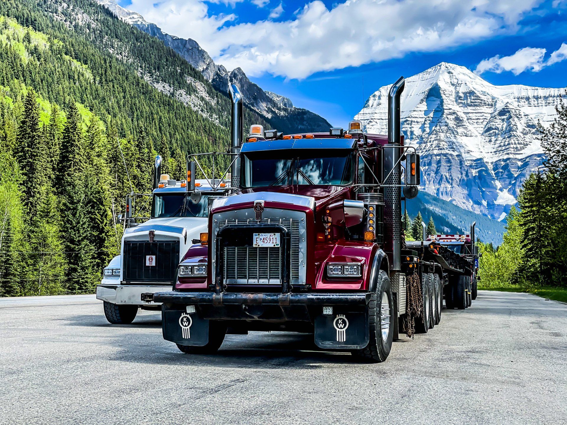 winch tractors with hi boy trailers hauling in British Columbia.