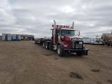 A picture of a winch tractor in RB Oilfield Hauling's yard in Grande Prairie.