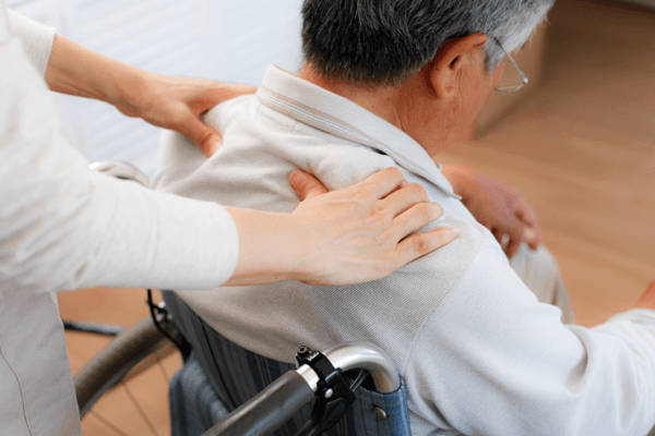 shoulder massage for an aged man