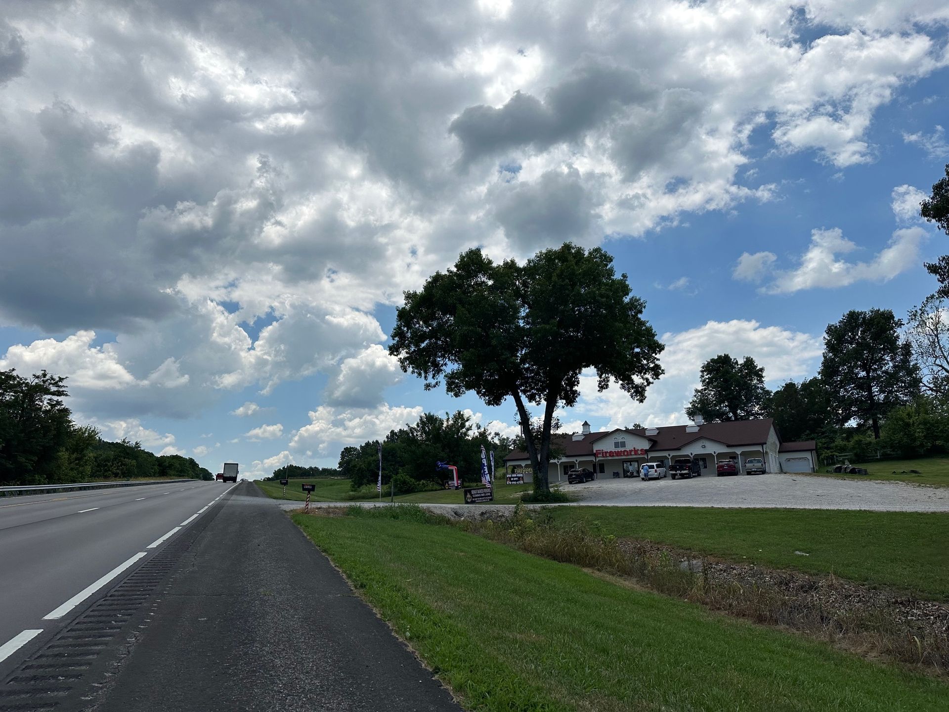 A road with a tree on the side of it