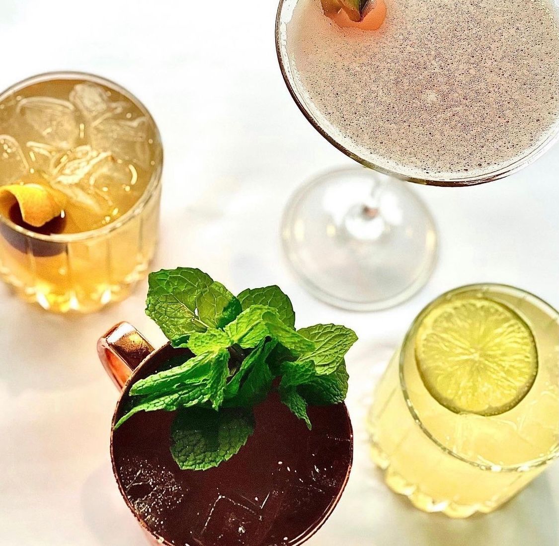 Three different types of drinks are on a table