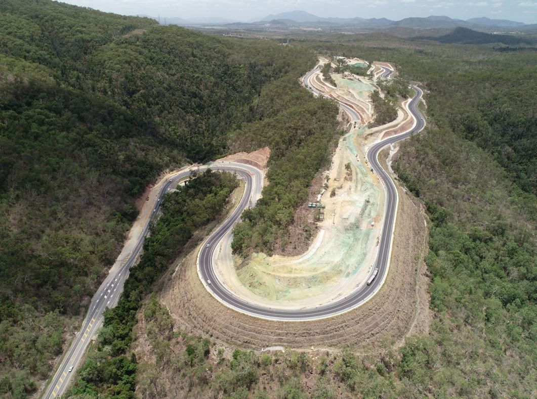 An Aerial View of A Winding Road Surrounded by Trees — Mass Construction Group Australia Pty Ltd in South Mackay, QLD