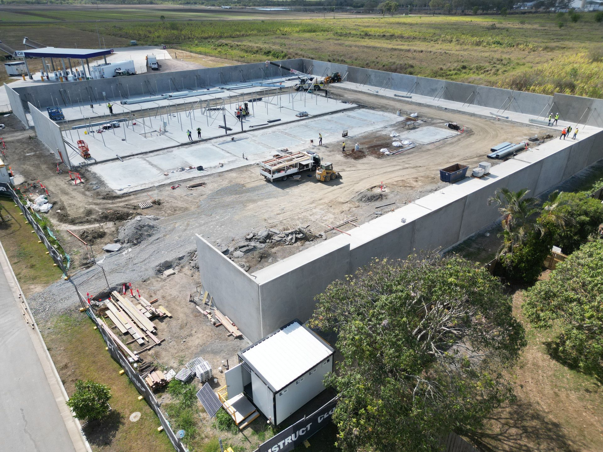 A Yellow Excavator Is Digging a Hole in The Ground — Mass Construction Group Australia Pty Ltd in South Mackay, QLD