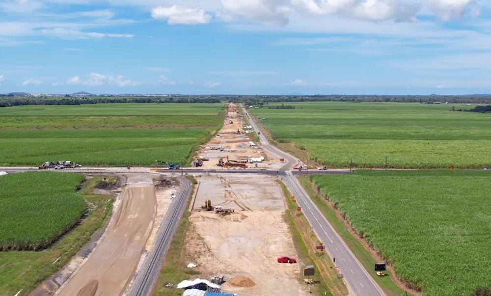 An Aerial View of A Road Going Through a Lush Green Field — Mass Construction Group Australia Pty Ltd in South Mackay, QLD