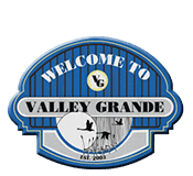 A blue sign that says `` welcome to valley grande ''