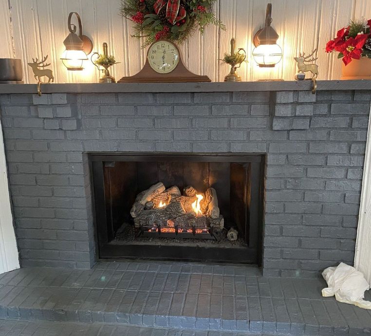 A fireplace with a clock on top of it